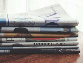 Stack of newspapers Featured Shared Screen